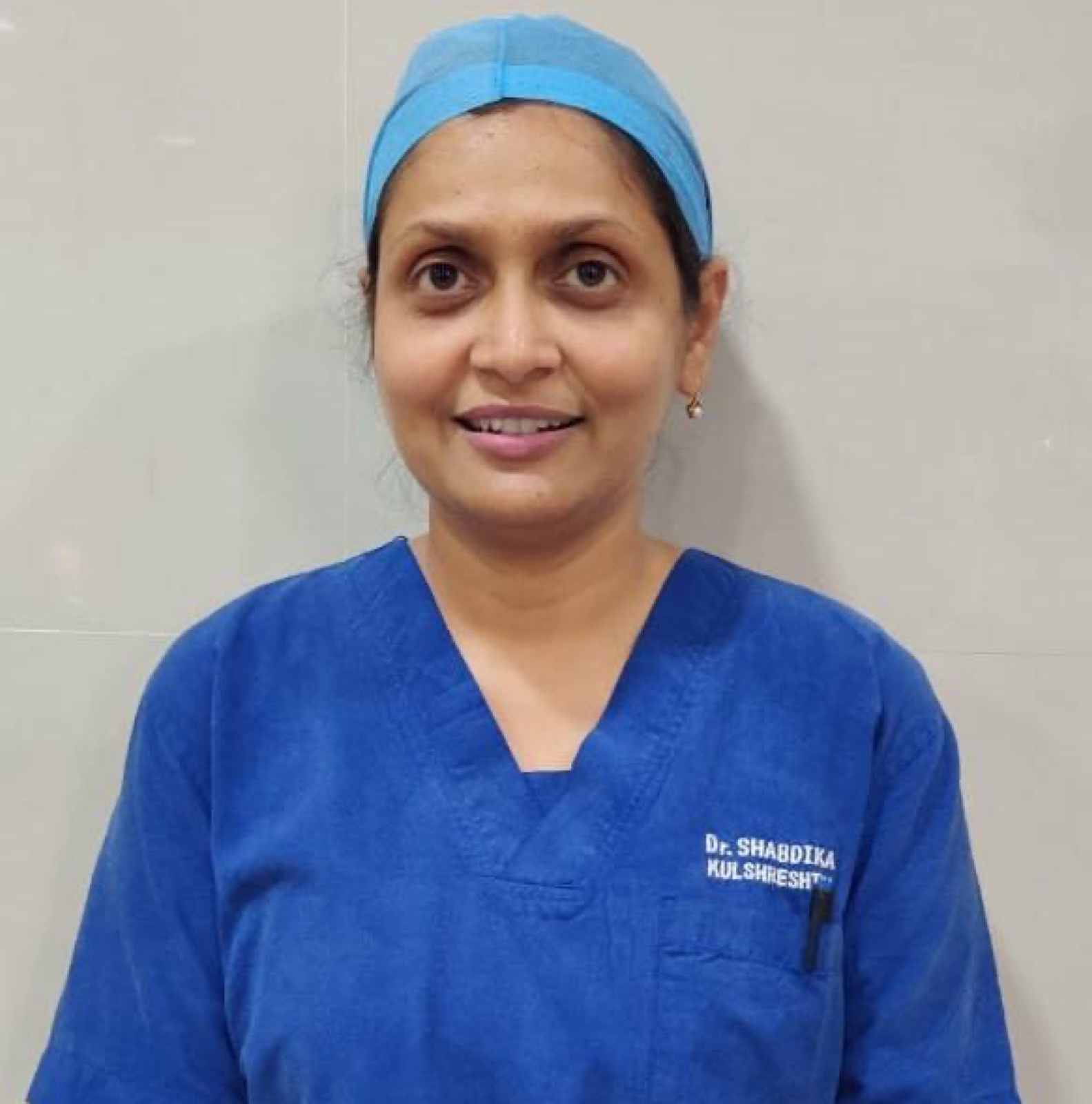 Dr. Shabdika Kulshreshtha in surgical scrubs